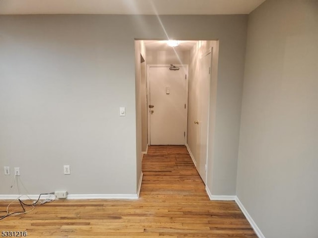 hallway featuring light hardwood / wood-style flooring