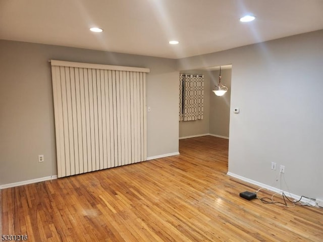 spare room featuring light wood-type flooring