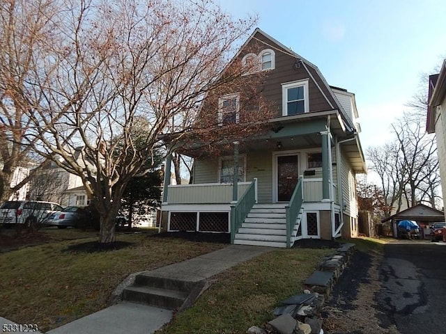 view of front of house featuring a front lawn and a porch