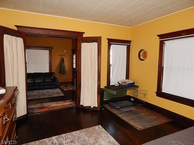 hallway with hardwood / wood-style floors