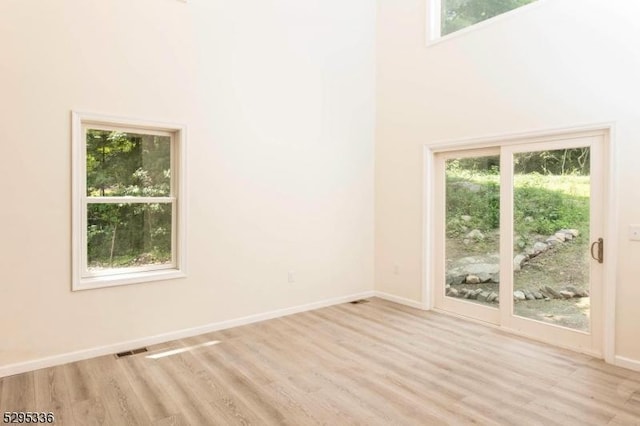 spare room featuring light hardwood / wood-style floors