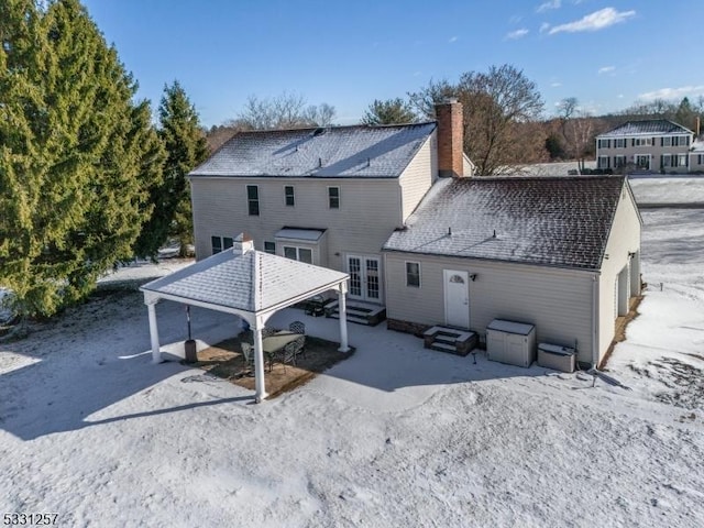 rear view of property featuring french doors