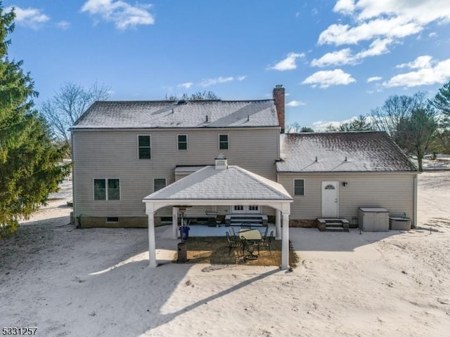 back of property featuring a patio area