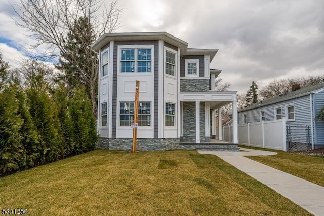 view of front of house with a porch and a front yard