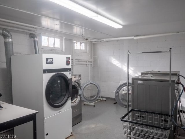 clothes washing area featuring washing machine and dryer