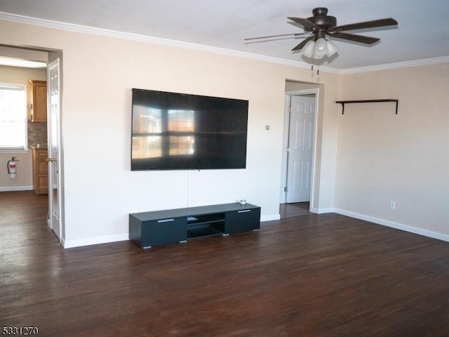 unfurnished living room with ceiling fan, crown molding, and dark wood-type flooring