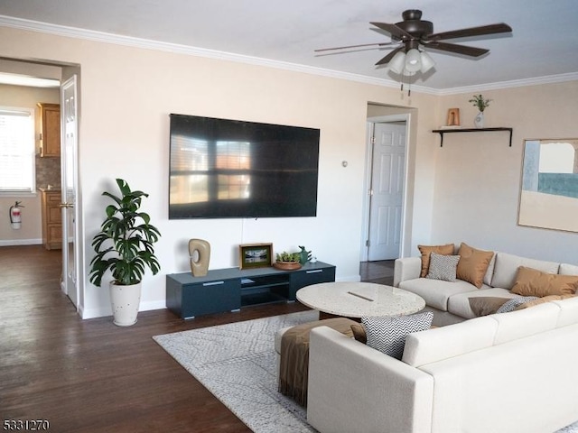 living room with dark hardwood / wood-style flooring, ornamental molding, and ceiling fan