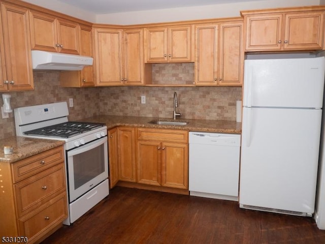 kitchen with sink, white appliances, tasteful backsplash, light stone countertops, and dark hardwood / wood-style flooring