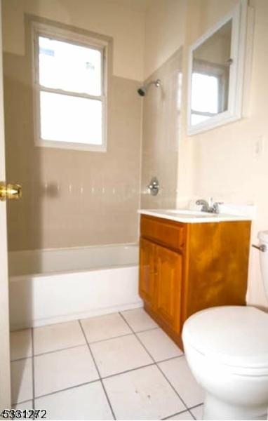 full bathroom featuring tile patterned flooring, vanity, toilet, and tiled shower / bath combo