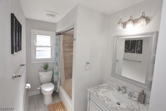 full bathroom featuring toilet, vanity, and shower / bath combo with shower curtain