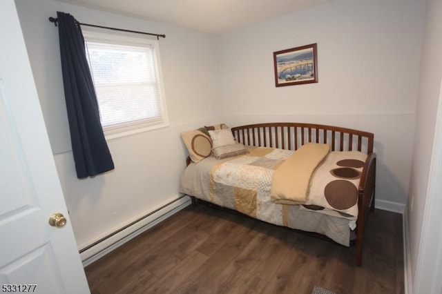 bedroom featuring a baseboard radiator and dark wood-type flooring