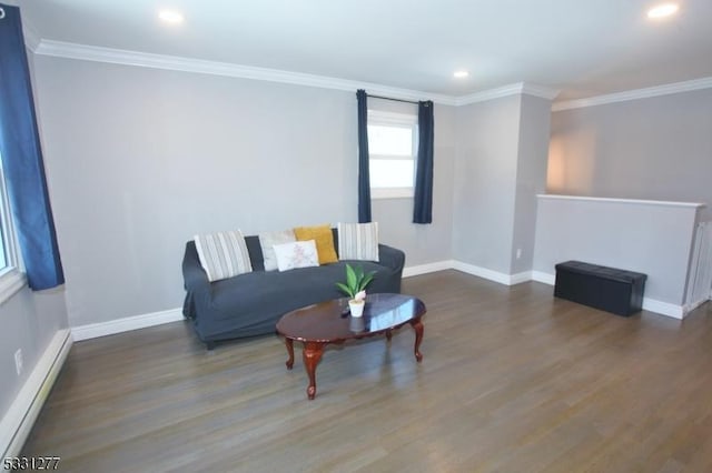 sitting room with dark hardwood / wood-style flooring, ornamental molding, and a baseboard radiator