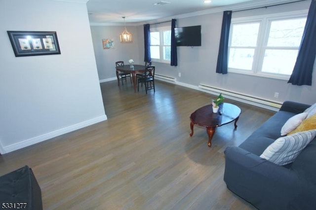 living room featuring baseboard heating, crown molding, and dark wood-type flooring