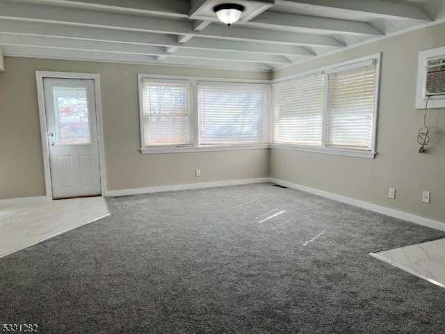 carpeted foyer entrance featuring beam ceiling