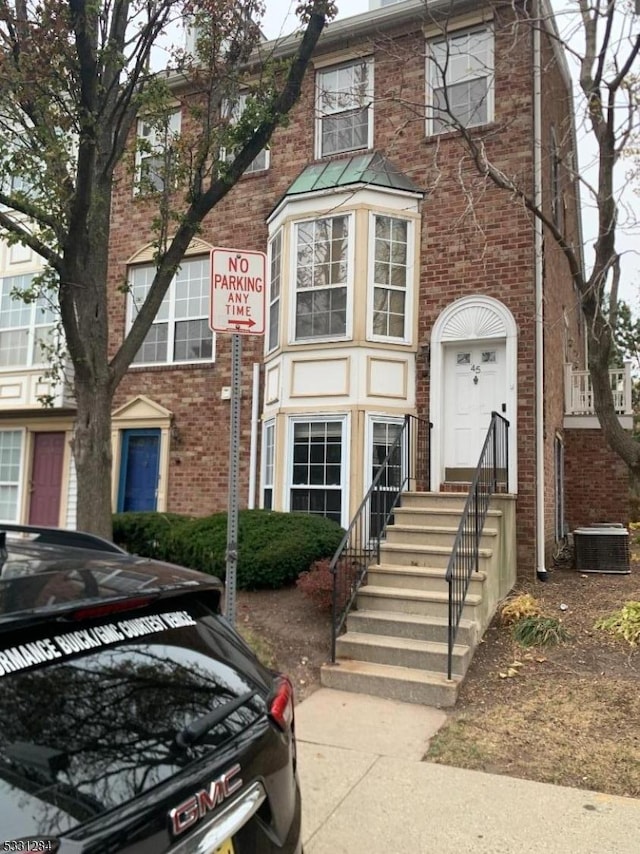 view of front facade featuring cooling unit