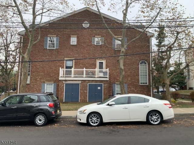 view of front of property with a balcony