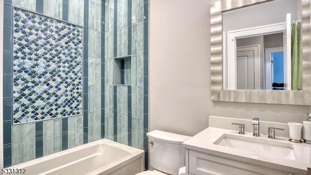 full bathroom with toilet, vanity, and tiled shower / bath combo