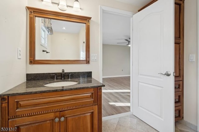 bathroom with ceiling fan, tile patterned floors, and vanity