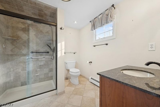 bathroom featuring toilet, vanity, an enclosed shower, and a baseboard radiator