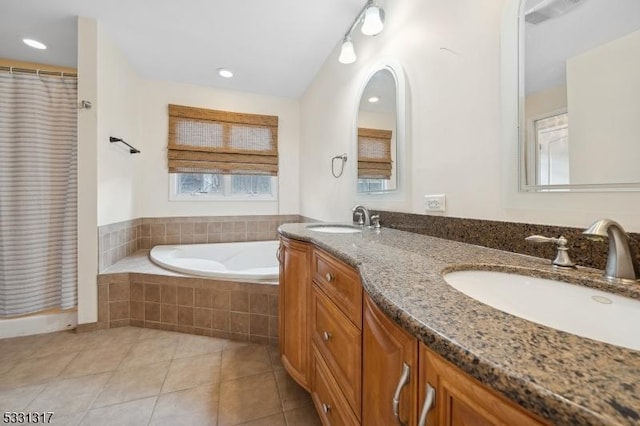 bathroom with tile patterned floors, vanity, and plus walk in shower