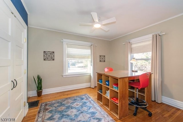 interior space with wood-type flooring, ceiling fan, and crown molding