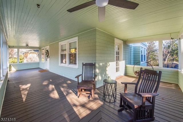 wooden deck featuring ceiling fan and a porch