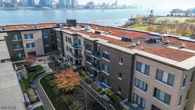 birds eye view of property with a water view