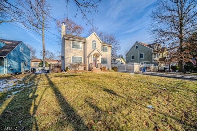 front facade with a front yard