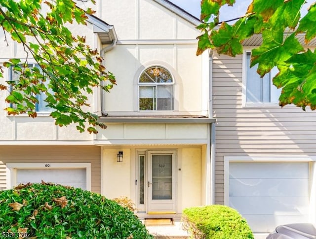 view of exterior entry with a garage