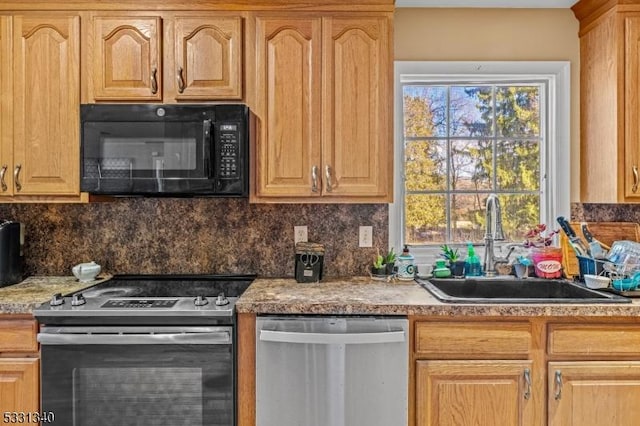 kitchen featuring decorative backsplash, stainless steel appliances, and sink