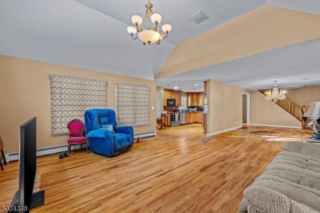 living room featuring lofted ceiling, light hardwood / wood-style flooring, baseboard heating, and an inviting chandelier