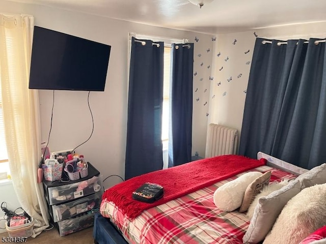 bedroom featuring radiator heating unit