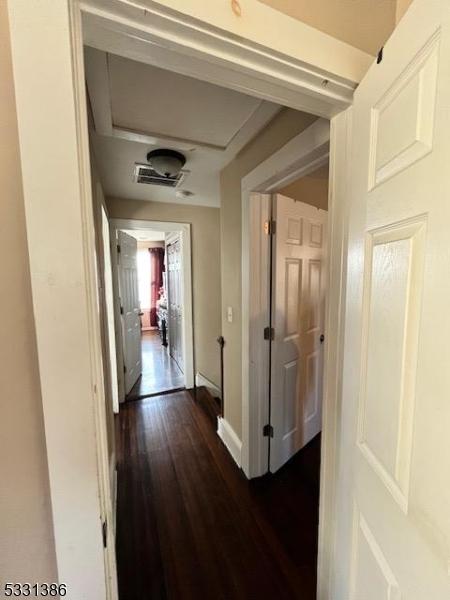 hallway featuring dark hardwood / wood-style floors