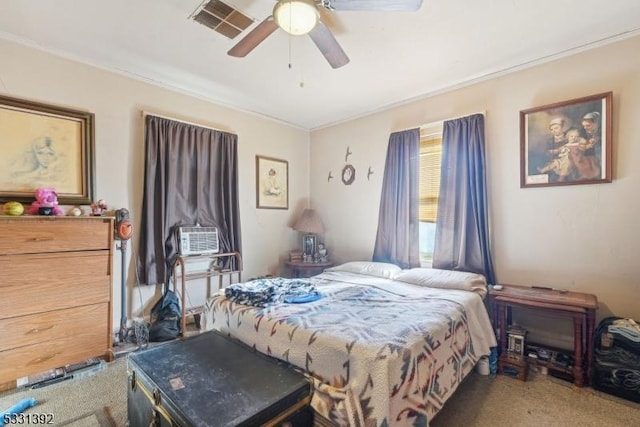 carpeted bedroom with ceiling fan and cooling unit