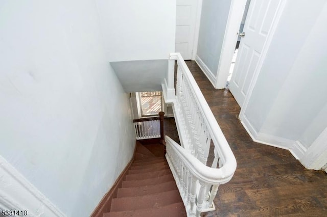 stairway with wood-type flooring