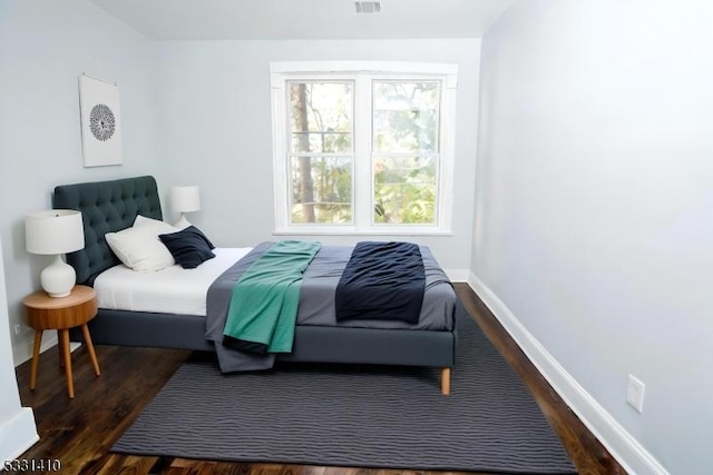 bedroom featuring dark wood-type flooring