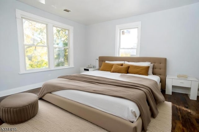 bedroom with wood-type flooring