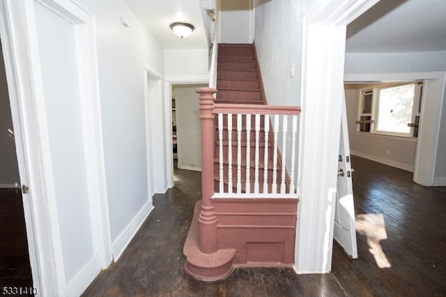 stairs with wood-type flooring