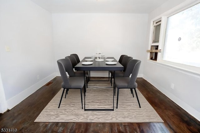 dining area with hardwood / wood-style flooring