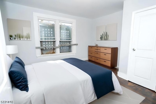 bedroom featuring dark hardwood / wood-style flooring