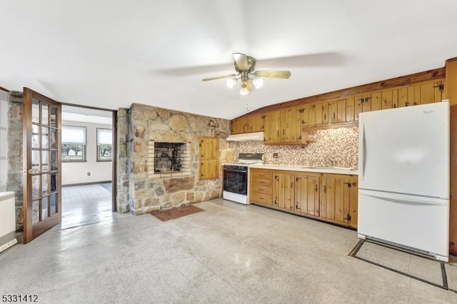 kitchen with white appliances, ceiling fan, a sink, light countertops, and under cabinet range hood