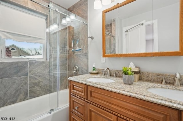 bathroom featuring vanity and enclosed tub / shower combo