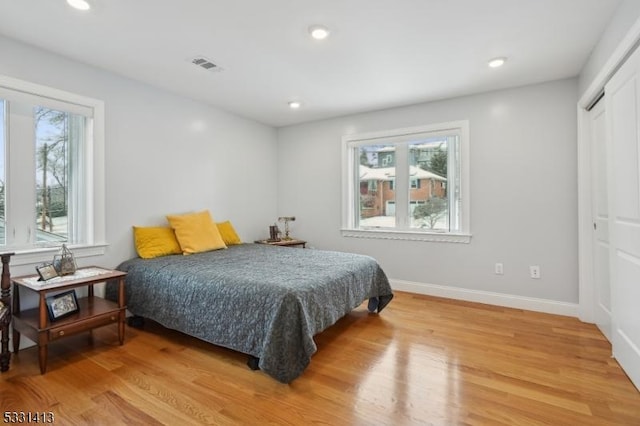 bedroom featuring hardwood / wood-style flooring and a closet