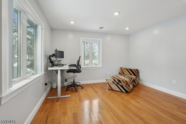 office with light hardwood / wood-style flooring