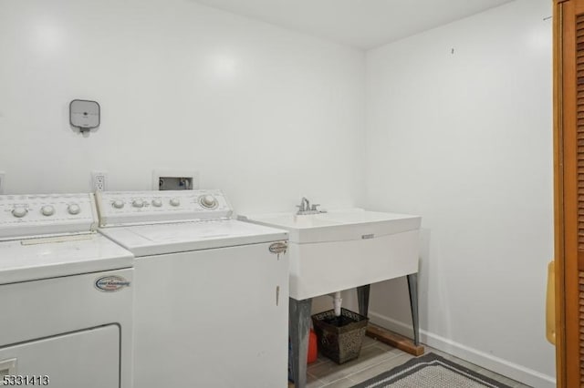 washroom with separate washer and dryer