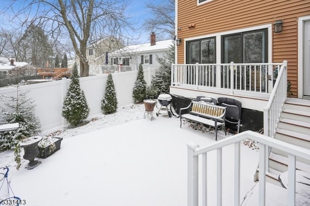 view of yard layered in snow