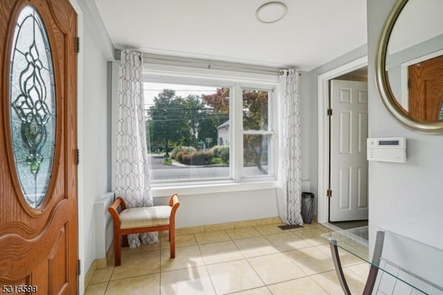 tiled entryway with a healthy amount of sunlight