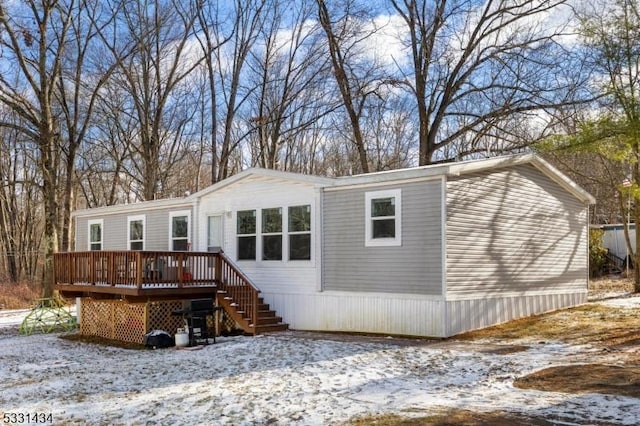 view of front of property featuring a wooden deck