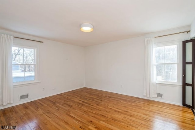 unfurnished room featuring light hardwood / wood-style floors