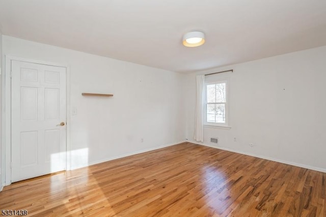 empty room featuring hardwood / wood-style floors